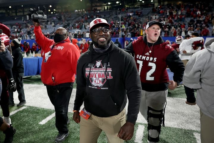 Warner Robins coach Marquis Westbrook celebrates as time expires during their 62-28 win against against Cartersville in the Class 5A state high school football final at Center Parc Stadium Wednesday, December 30, 2020 in Atlanta. JASON GETZ FOR THE ATLANTA JOURNAL-CONSTITUTION