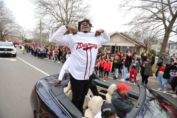 Georgia defensive tackle Jordan Davis reacts to the crowd showing his support to the Atlanta Braves as the victory parade flew through the UGA  campus on Saturday, January 15, 2022 Miguel Martinez for The Atlanta Journal-Constitution