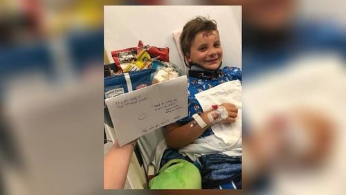 Jake Bachman, 10, of Hoschton, is in a Tennessee children's hospital after a July 8 crash killed his mother, sister and brother.