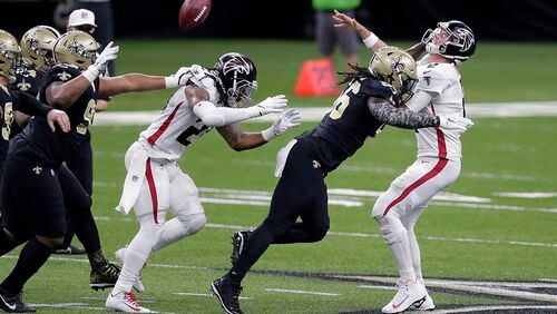 Falcons quarterback Matt Ryan (2) is hit by Saints outside linebacker Demario Davis (56) in the first half Sunday, Nov. 22, 2020, in New Orleans. (Brett Duke/AP)