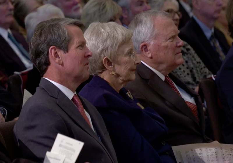Brian Kemp, left, with Sandra and Gov. Nathan Deal at the funeral for Justice Harris Hines.