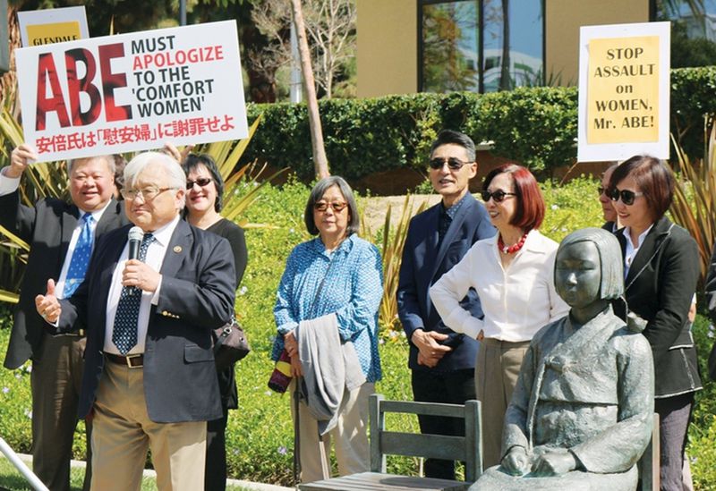 Former U.S. Congressman Mike Honda stands by a Comfort Women statue in Glendale, Calif. One will be unveiled in Brookhaven on June 30. CONTRIBUTED BY JAPANESE CONSULATE