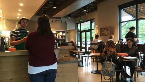 A Starbucks in Marietta became the office for displaced Florida residents whose Cobb County hosts lost power after Irma. ELLEN ELDRIDGE / ELLEN.ELDRIDGE@AJC.COM