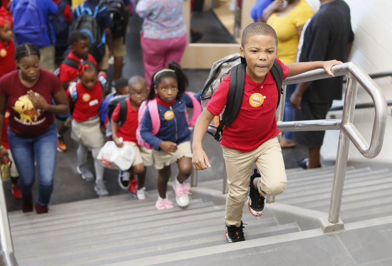 August 12, 2019, 2019 - Atlanta - Students head to class on the first day of school at Tuskegee Airmen Global Academy, where the district is opening a new school building. The cost of the building project was $30.5 million. Bob Andres / robert.andres@ajc.com