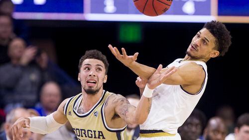Notre Dame's Prentiss Hubb (right) recovers the ball during a steal attempt by Georgia Tech's Jose Alvarado (10) during the first half Sunday, Feb. 10, 2019, in South Bend, Ind.