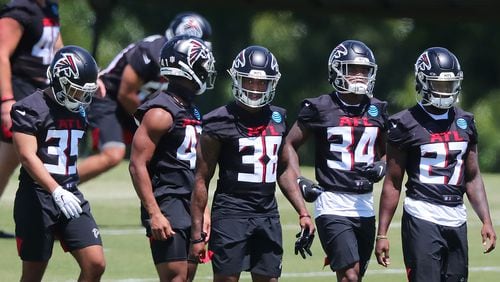 Falcons rookie cornerbacks and safeties Avery Williams (from left), JR Pace, Marcus Murphy, Darren Hall, and Richie Grant line up to run a defensive drill during rookie minicamp on Friday, May 14, 2021, in Flowery Branch. (Curtis Compton / Curtis.Compton@ajc.com)