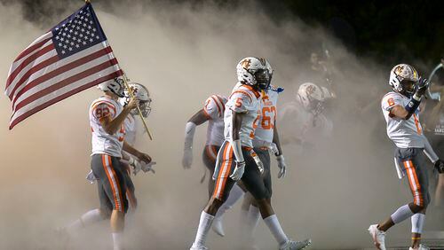 The North Cobb Warriors take the field at the start of their game at Harrison High School Friday.