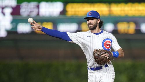 Chicago Cubs' Dansby Swanson throws to first in a baseball game against the New York Mets Tuesday, May 23, 2023, in Chicago. (AP Photo/Charles Rex Arbogast)