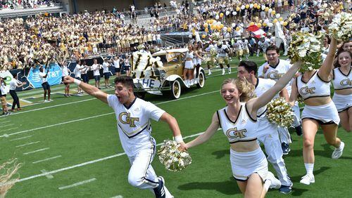 Georgia Tech's Ramblin' Wreck leads the band, cheerleaders, Buzz, players, and coaches before the start of the Georgia Tech home opener against the Alcorn State on Saturday, September 1, 2018. HYOSUB SHIN / HSHIN@AJC.COM