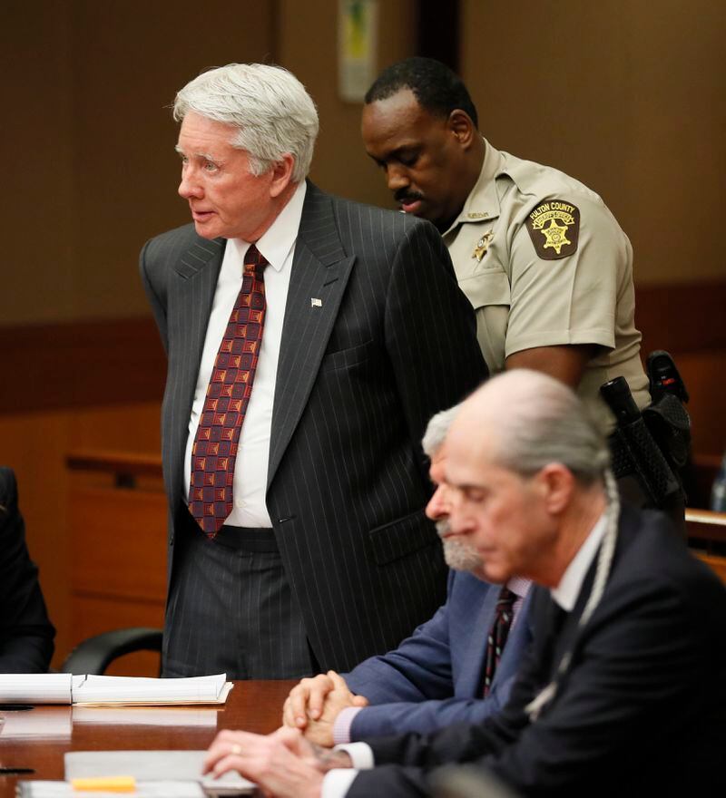 After being found guilty, Tex McIver is handcuffed and taken into custody. (Bob Andres/bandres@ajc.com)
