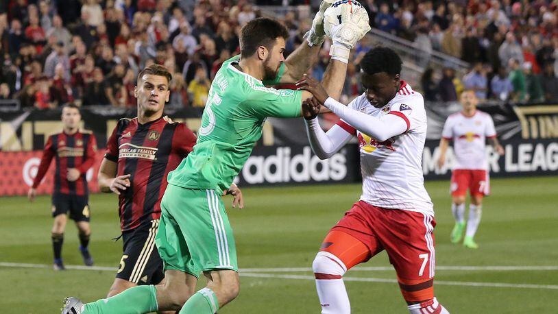 Atlanta United RC  N.Y. goalkeeper Alec Kann blocks a shot by Red Bulls Derrick Etienne during the second half in the first game in franchise history on Sunday, March 5, 2017, in Atlanta.   Curtis Compton/ccompton@ajc.com