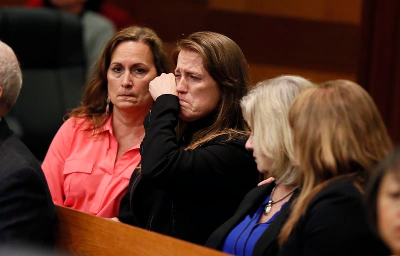 4/23/18 - Atlanta - Tex and Diane McIver's masseuse, Annie Anderson (center), reacts to the verdict.  The jury found Tex McIver guilty on four of five charges on their fifth day of deliberations today at the Tex McIver murder trial at the Fulton County Courthouse.   Bob Andres bandres@ajc.com