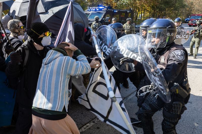 Protestors demonstrating against Atlanta’s public training safety center clash with police in Atlanta on Monday, November 13, 2023. (Arvin Temkar / arvin.temkar@ajc.com)