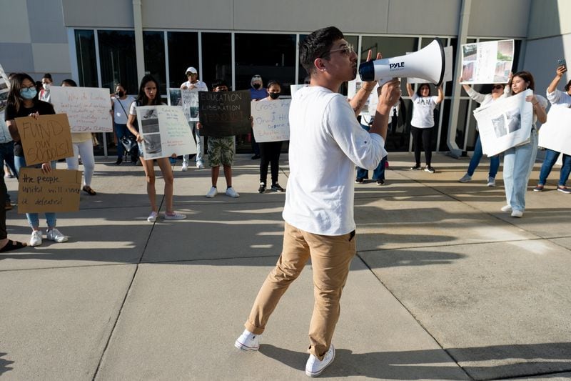 Jonathan Peraza Campos rallies students outside of the DeKalb County Board of Education to draw attention to building needs at Cross Keys High School on May 9, 2022, at the district's headquarters in Stone Mountain, Georgia. Ben Gray for The Atlanta Journal-Constitution
