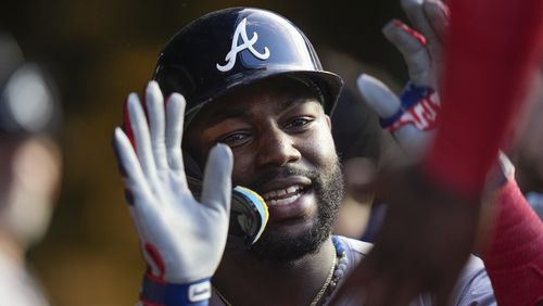 Atlanta Braves' Michael Harris II celebrates in the dugout after hitting a home run against the Chicago Cubs during the fourth inning of a baseball game Tuesday, May 21, 2024, in Chicago. (AP Photo/Erin Hooley)