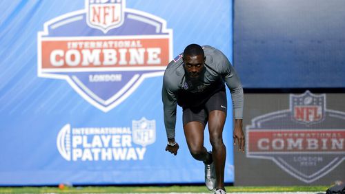 Kehinde Oginni of Nigeria participates in a drill at the NFL international scouting combine at Tottenham Hotspur Stadium in London, Tuesday, Oct. 12, 2021. (AP Photo/Steve Luciano)