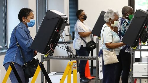 051820 Marietta: Voters wear masks and cast their ballots at least six feet apart the first day of early voting at the Cobb County Board of Elections & Registration on Monday afternoon, May 18, 2020, in Marietta.