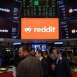 FILE - Reddit Inc. signage is seen on the New York Stock Exchange trading floor, prior to Reddit IPO, Thursday, March. 21, 2024. OpenAI and Reddit are teaming up in a deal that will bring the social media platform's content to ChatGPT. Shares of Reddit jumped 17% before the market open on Friday, May 17. (AP Photo/Yuki Iwamura, File)