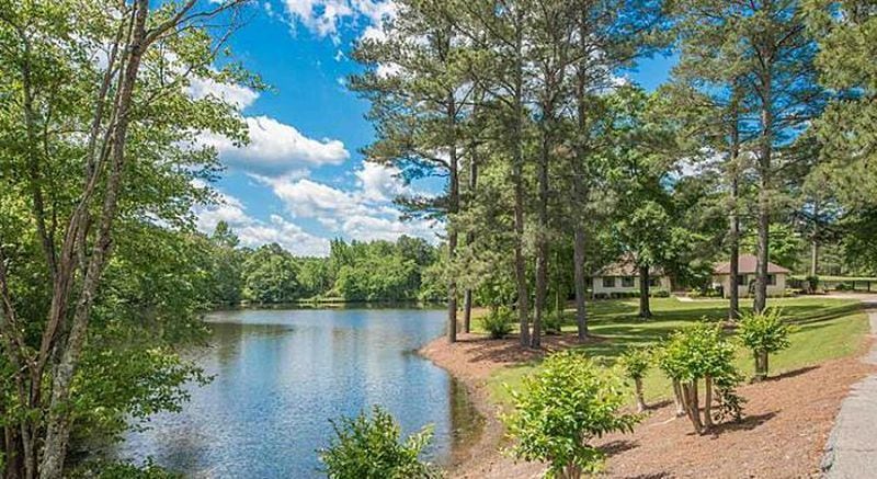 This Tyrone, Georgia house in the $1 million range includes 31 acres and its own lake.