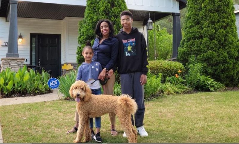 Ronna Charles with her two children, Nadia, 7, and Spencer, 15, and their dog, Teddy. The family is taking steps to help Teddy adjust to them being away more as life opens up as the pandemic eases. (Courtesy of Ronna Charles)