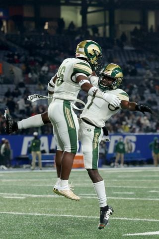 Dec. 30, 2020 - Atlanta, Ga: Grayson running back Jayvian Allen (16, left) celebrates a rushing touchdown with wide receiver Jamal Haynes in the first half against Collins Hill during the Class 7A state high school football final at Center Parc Stadium Wednesday, December 30, 2020 in Atlanta. JASON GETZ FOR THE ATLANTA JOURNAL-CONSTITUTION