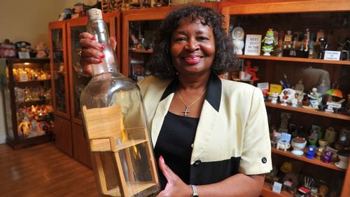 Barbara Hartsfield, owner of the Collectible and Antique Chair Gallery in Stone Mountain, boasts more than 3,000 miniature chairs. Among her favorites is this chair in a bottle. "Maybe one day I'll find out how they do that," she said.