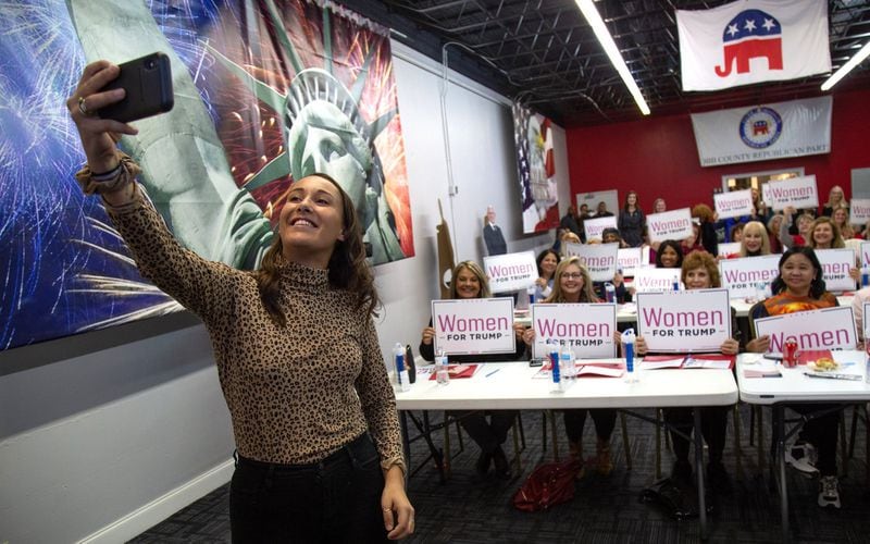 Kiera Wainer, Women’s Engagement Coordinator for the Republican National Committee, takes a selfie after talking about the importance of social engagement at the Democratic debate watch party at the Cobb County Republican Party Headquarters in Marietta. Photo: Steve Schaefer for the AJC