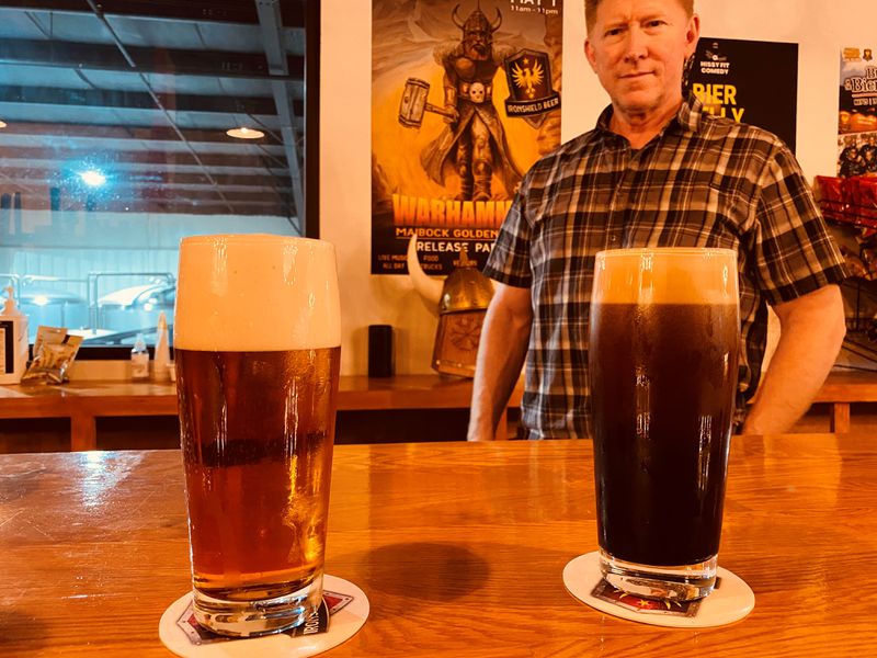 A seasonal Maibock Lager and a Nitro Dry Irish Stout currently are among the beers on tap at Ironshield Brewing in Lawrenceville. Behind the bar is Ironshield co-founder Glen Sprouse. Bob Townsend for AJC