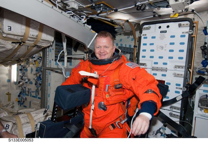 Astronaut Eric Boe, STS-133 pilot, is seen on the middeck of the space shuttle Discovery soon after reaching Earth orbit on flight day one. Boe is still in his launch and entry escape suit. Photo taken on Feb. 24, 2011.Photo credit: NASA