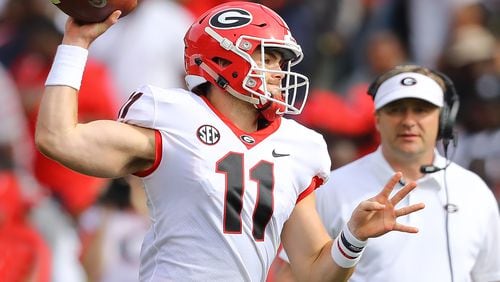 Georgia head coach Kirby Smart watches from the field while Jake Fromm throws during the annual G-Day spring game on Saturday, April 21, 2018, in Athens.
