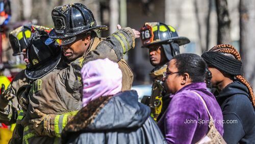 Heavy smoke and flames had taken over the roof of three units at the community on Maypop Lane in Decatur by the time firefighters arrived.