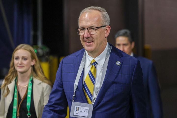 SEC Commissioner Greg Sankey walks onto the field during the first half of the SEC Championship football game between the Georgia Bulldogs and the Alabama Crimson Tide at the Mercedes-Benz Stadium in Atlanta, on Saturday, December 2, 2023. (Jason Getz / Jason.Getz@ajc.com)