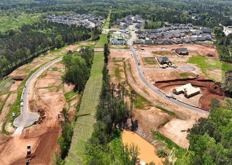 April 20, 2022 Powder Springs - Aerial photograph shows proposed area of the city of Lost Mountain in West Cobb on Wednesday, April 20, 2022. Construction of residential area near Lost Mountain Park is shown in foreground. The story plays on a fear shared by many West Cobb residents as they decide whether to incorporate the city of Lost Mountain. The county they call home is changing around them, and as conservative political power wanes in the growing Atlanta suburb, many feel helpless to protect their neighborhoods from encroaching development.(Hyosub Shin / Hyosub.Shin@ajc.com)