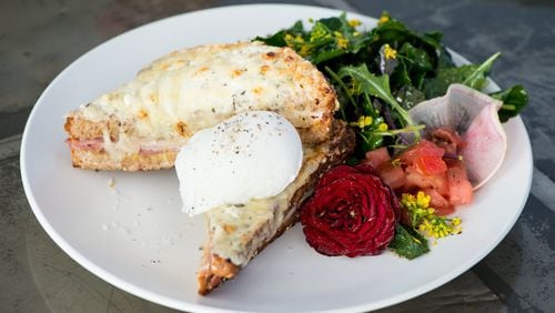 Petit Chou’s Croque Madame is a grilled ham and cheese melt topped with Gruyere and a poached egg. CONTRIBUTED BY MIA YAKEL