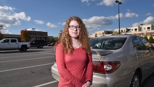 Sarah Saltzman stands in the AVALON Whole Foods market parking lot where her she had to pay $75 to get her car unbooted. HYOSUB SHIN / HSHIN@AJC.COM