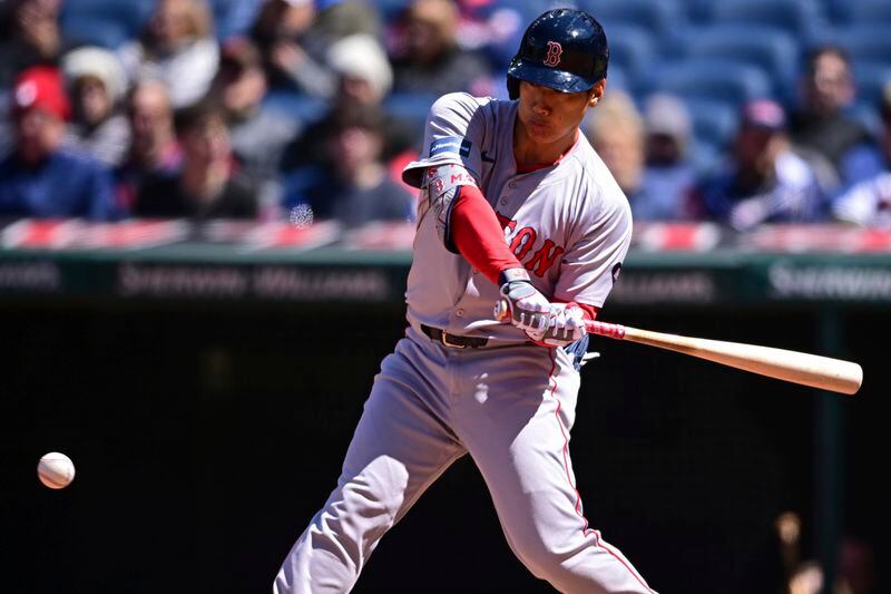 Boston Red Sox's Masataka Yoshida swings during the fifth inning of a baseball game against the Cleveland Guardians, Thursday, April 25, 2024, in Cleveland. (AP Photo/David Dermer)