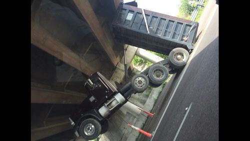 Dump truck was stuck under an overpass along I-4 west at the Florida Turnpike.