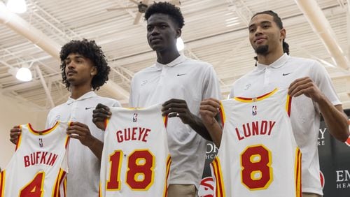 (Left to right) Kobe Bufkin the 15th overall pick, Mouhamed Gueye, the 39th pick from the Celtics, and 46th overall pick Seth Lundy pose for a photo following an introductory press conference at the Hawks training facility in Atlanta on Monday, June 26, 2023  (Natrice Miller/ Natrice.miller@ajc.com)