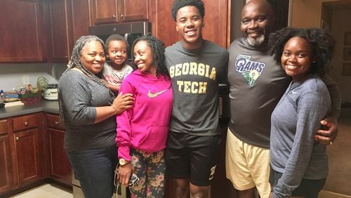 Georgia Tech freshman safety Jeremiah Smith (center) center with his family (from left to right, mother Denise, nephew Xaiden, sister Brianna, Jeremiah, father Rudy and sister Sierra) at their home in Grayson, May 13, 2019. (AJC photo by Ken Sugiura)