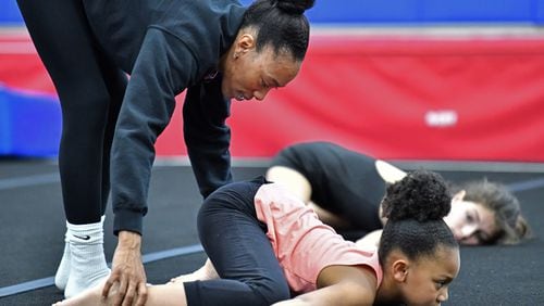 Gina White, owner of Phoenix Gymnastics, instructs her students at Hammond Park Gym. Sandy Springs terminated the rental agreement with the gymnastics vendor due to an outstanding payment balance. (Hyosub Shin / Hyosub.Shin@ajc.com)