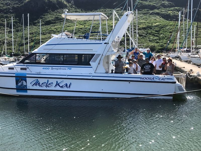 About a dozen of former Georgia and NFL star Jake Scott’s friends boarded the “Mele Kai,” his beloved fishing boat, one last time at Hanalei Pier in Hawaii. Their mission was to take Scott's ashes and spread them on Hanalei Bay. (Courtesy of Jake Scott's family)