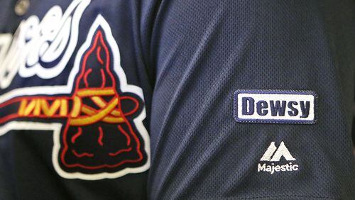 Braves honor former coach Bobby Dews with patch on jersey sleeve.