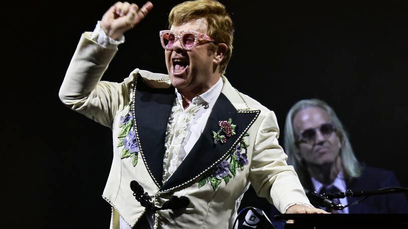 Elton John performs during Farewell Yellow Brick Road, The Final Tour at Mercedes-Benz Stadium on Thursday, Sept. 22, 2022.  (Natrice Miller / natrice.miller@ajc.com)