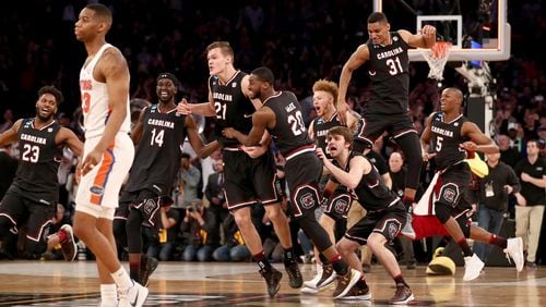 South Carolina Gamecocks celebrate defeating the Florida Gators to win the 2017 NCAA Men's Basketball Tournament East Regional at Madison Square Garden March 26, 2017, in New York City.