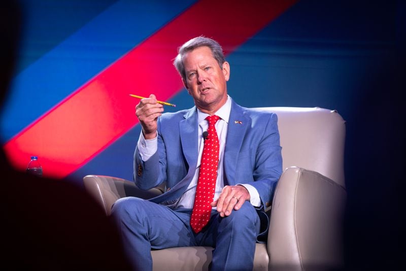 Gov. Brian Kemp, holding a pencil as a prop during his appearance at the Gathering political conference in Buckhead, told the crowd to “believe whatever you want about the 2020 election” as long as the party unites in 2024. “If we don’t win, we don’t get to govern,” he said. (Arvin Temkar / arvin.temkar@ajc.com)