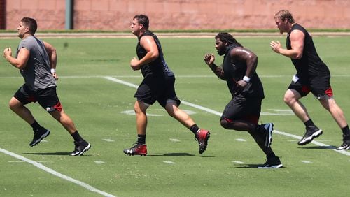 080420 Flowery Branch: Atlanta Falcons offensive lineman Alex Mack (from left), Chris Lindstrom, James Carpenter, and Kaleb McGary run sprints during a team strength and conditioning workout on Tuesday, August 4, 2020 in Flowery Branch.    Curtis Compton ccompton@ajc.com