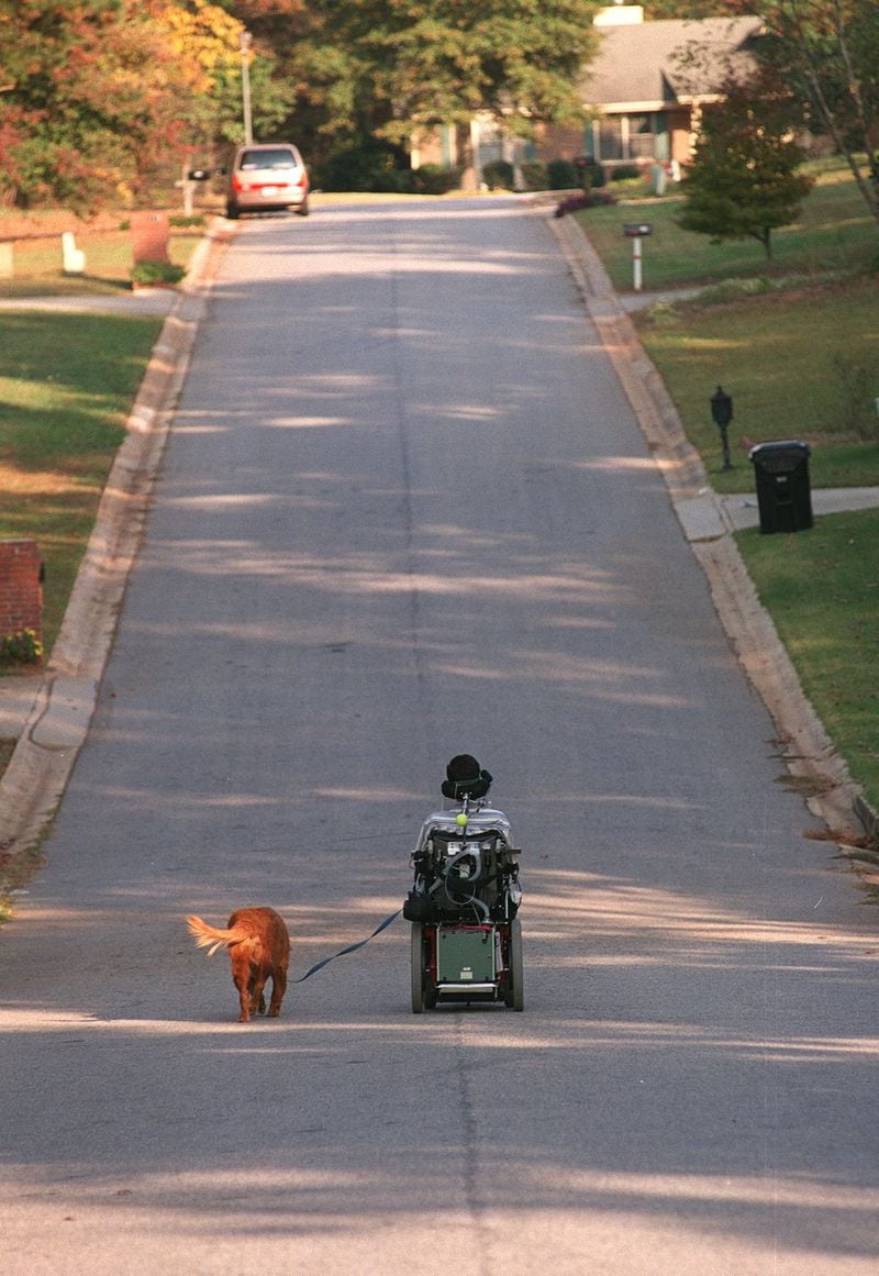 David Jayne taking his dog for a walk around the neighborhood in November 2000. 