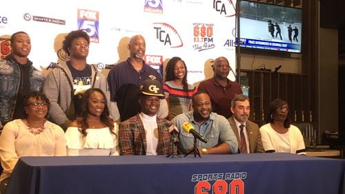 Georgia Tech signee Jamious Griffin at his college announcement Wedneday, February 6, 2019, at Sports and Social. Griffin is flanked by his mother LaBretha (left) and father Tyrone (right). Rome High coach John Reid is next to Tyrone Griffin. Griffin's brother Quon, a defensive lineman at Tech, is second from the left in the back row.