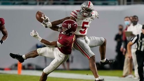 Alabama defensive back Brian Branch breaks up a pass intended for Alabama wide receiver Javon Baker during the first half of an NCAA College Football Playoff national championship game, Monday, Jan. 11, 2021, in Miami Gardens, Fla.