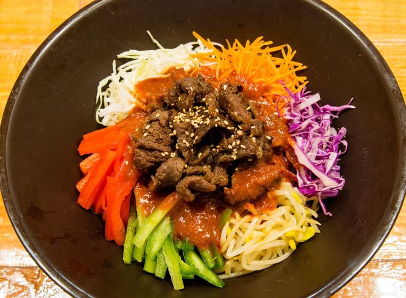 Sutbul bulgogi jaengban guksu combines noodles, vegetables and the traditional beef bulgogi at Dish Korean Cuisine. CONTRIBUTED BY HENRI HOLLIS